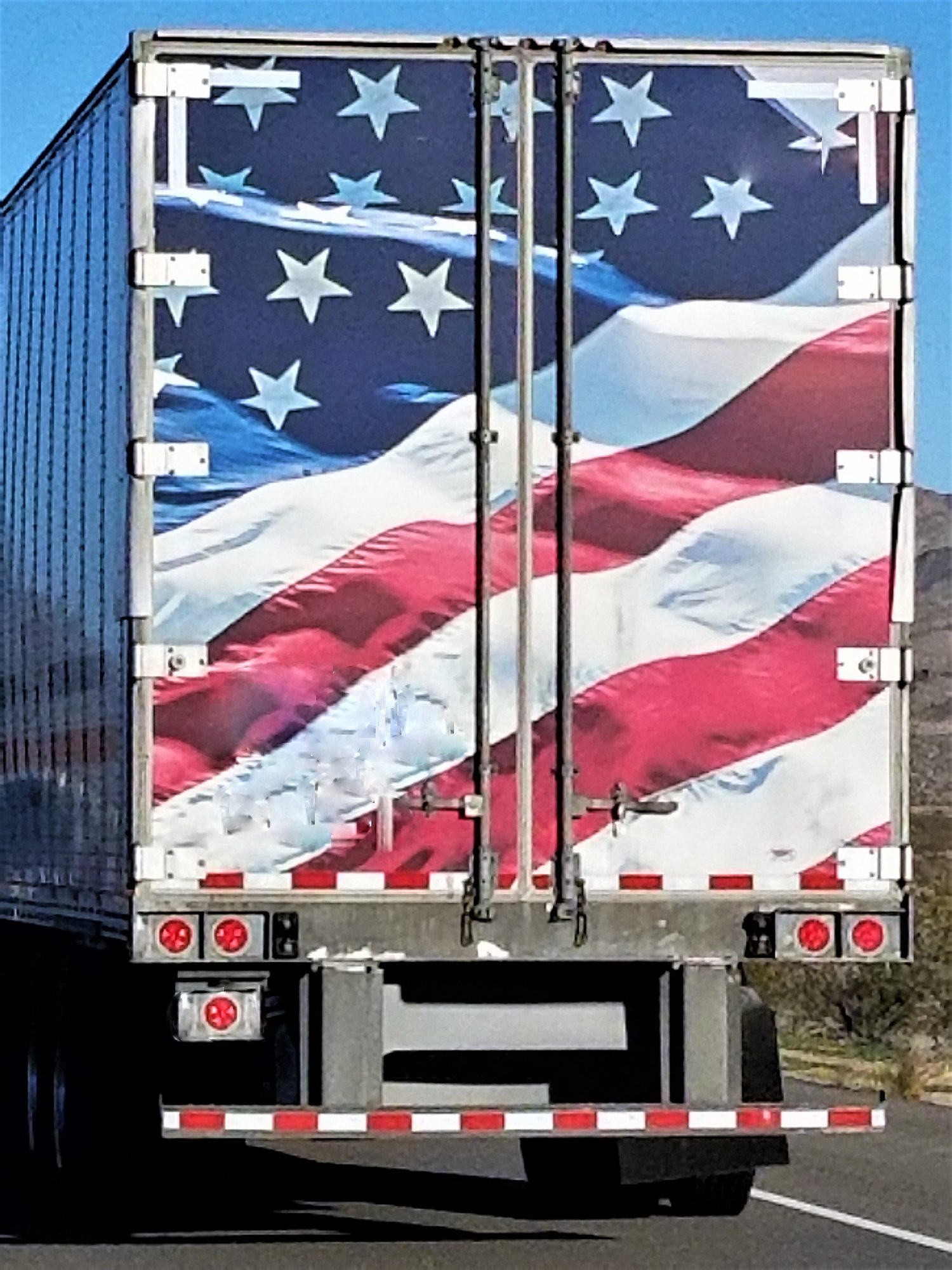 american-flag-on-back-of-semi-trailer-nominated-2025-02-22-17-06-51-utc